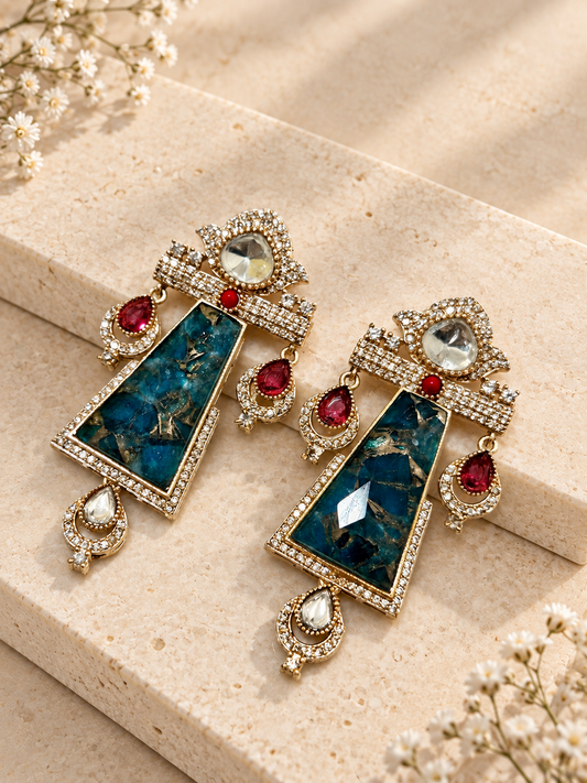 Shringara Doublet Earrings with Moissanite Polki AD Stone, Blue colour, on beige square stone with small white flowers.