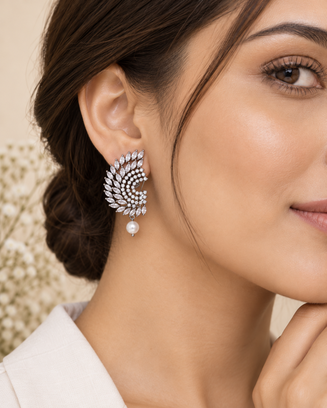 Modern model wearing white CZ pearl drop rhodium plated statement earrings
