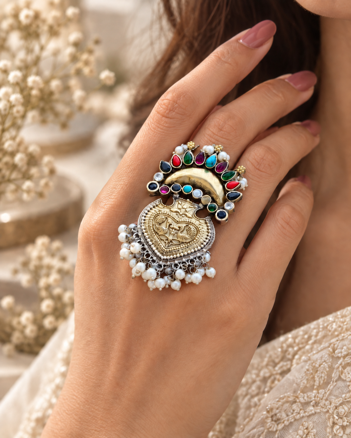 Dual tone multicolor silver lookalike brass statement ring worn on hand