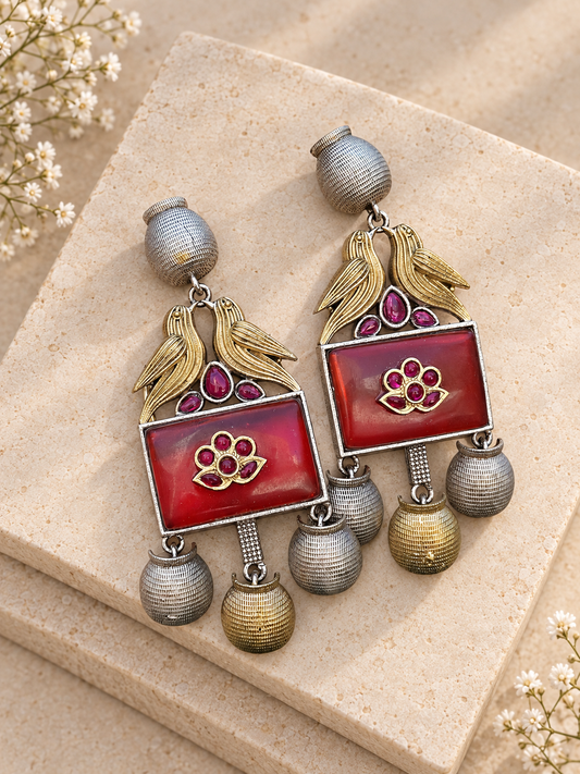 Silver Replica Dual Tone Monalisa Stone Bird Earrings, Maroon colour, on beige square stone with small white flowers.