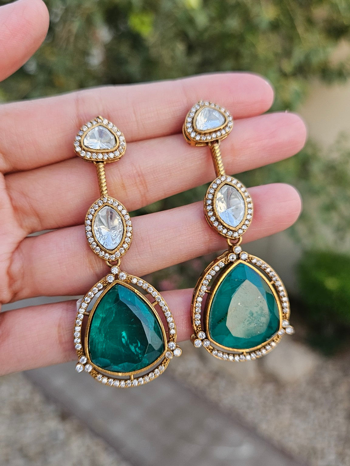 Green Moissanite Polki Kundan doublet stone earrings in natural daylight