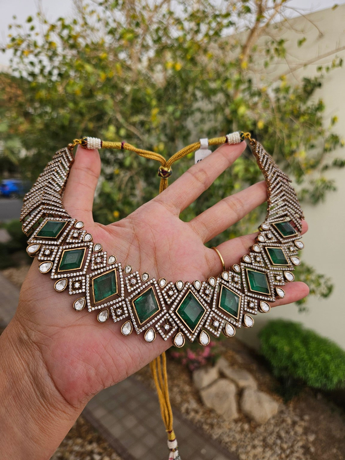 Mint green doublet stone and AD necklace photographed in natural daylight