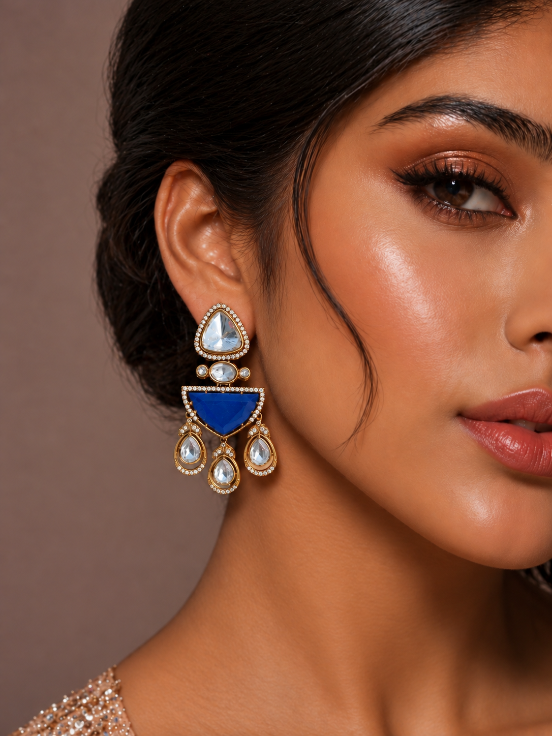 Model wearing blue doublet stone Moissanite Kundan Polki earrings with AD detailing