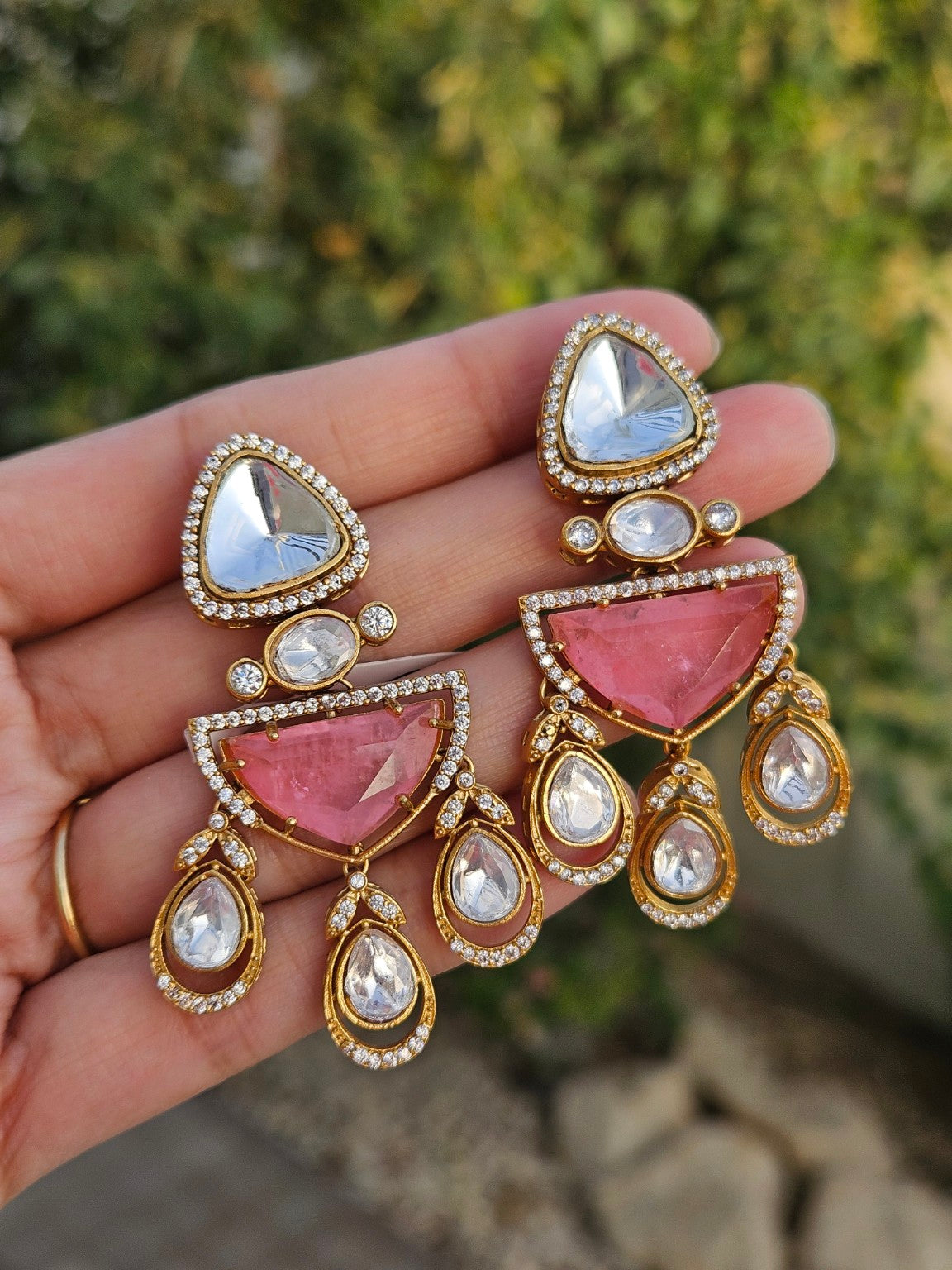 Pink doublet stone Moissanite Kundan Polki earrings photographed in natural daylight