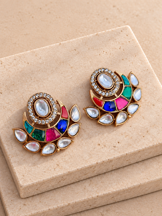 Multicolour crescent stud earrings with irregular coloured stones and clear teardrop borders on beige square stones.