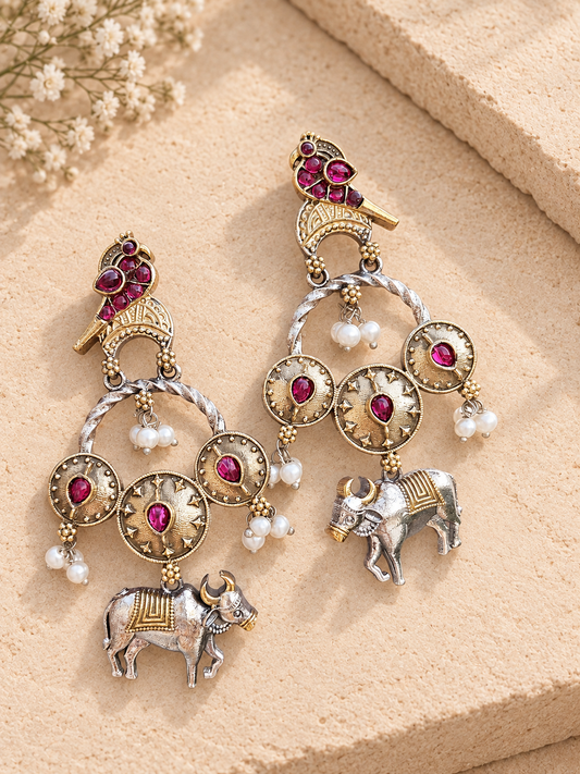 Dual-tone Nandi earrings with dark pink stones and white bead clusters on beige stone.