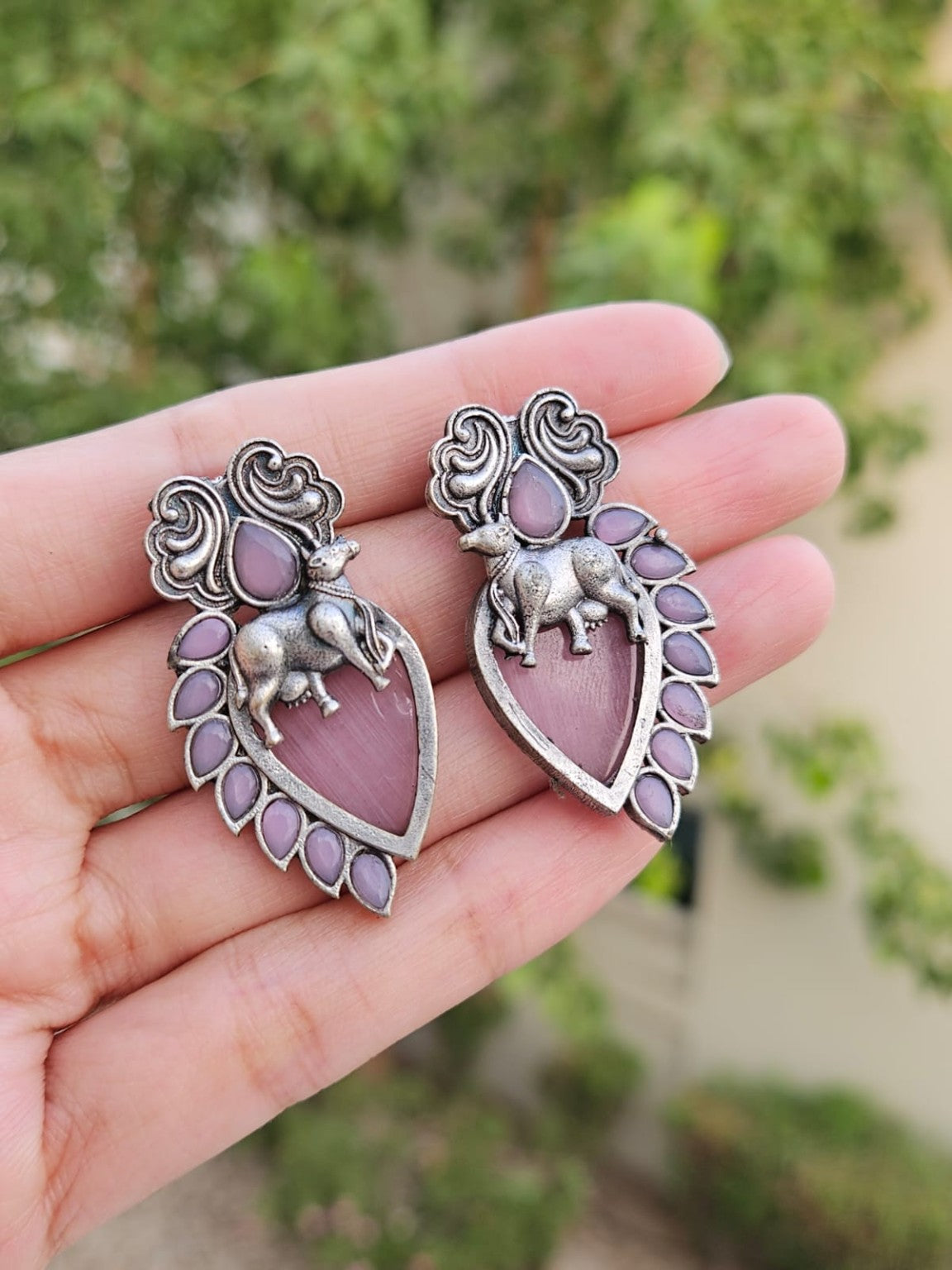 Mauve Nandi silver lookalike earrings with Mona Lisa stone in natural daylight
