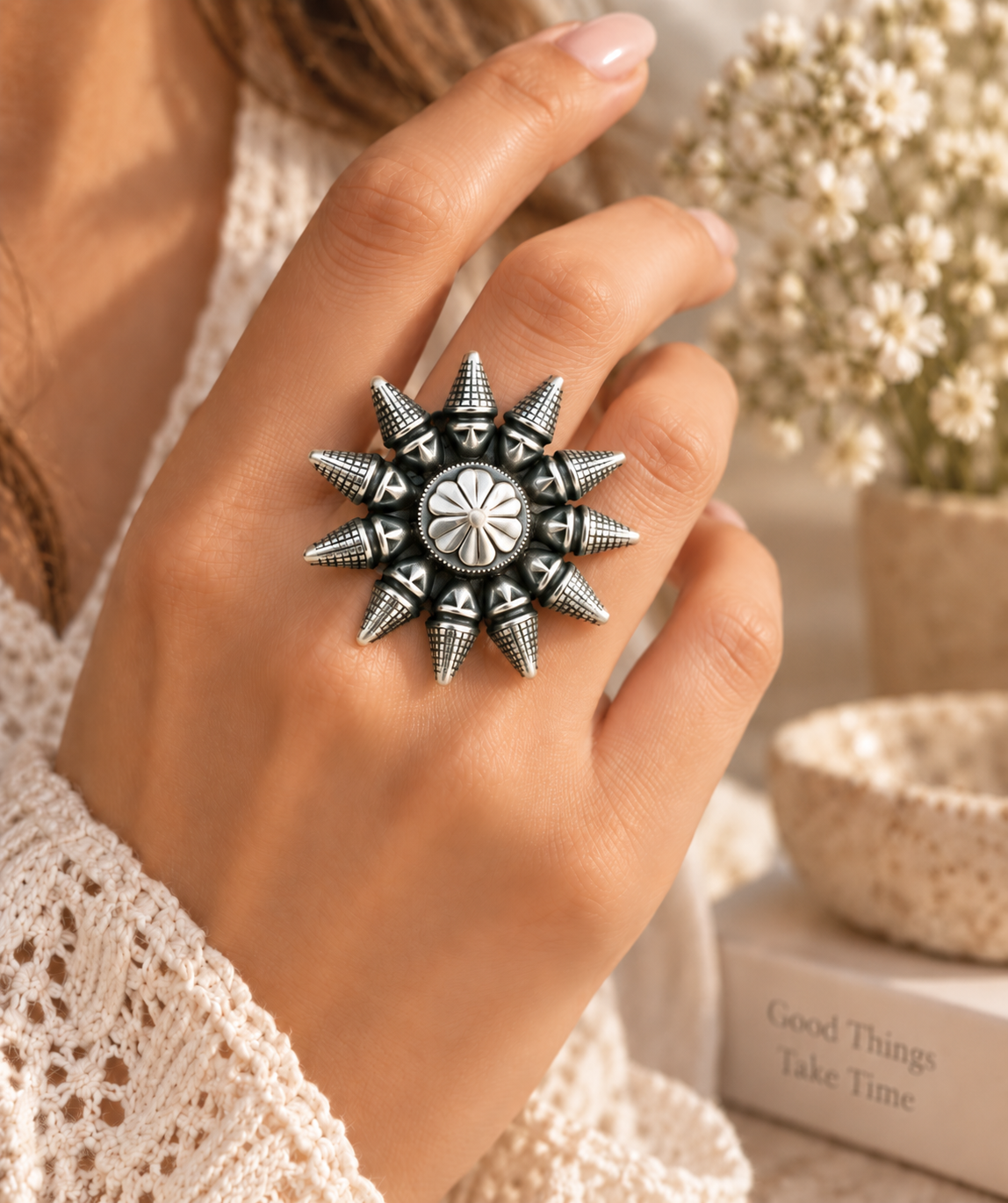 Oxidized silver lookalike brass sunburst ring worn on hand