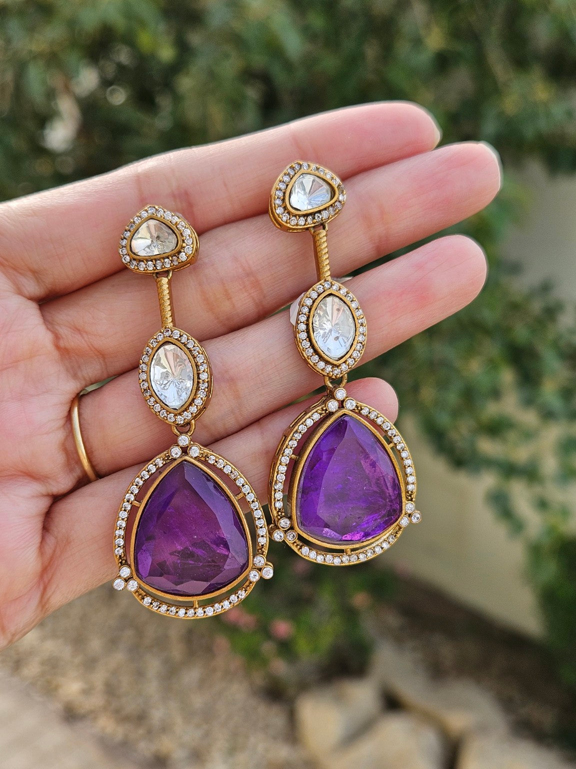 Purple Moissanite Polki Kundan doublet stone earrings in natural daylight