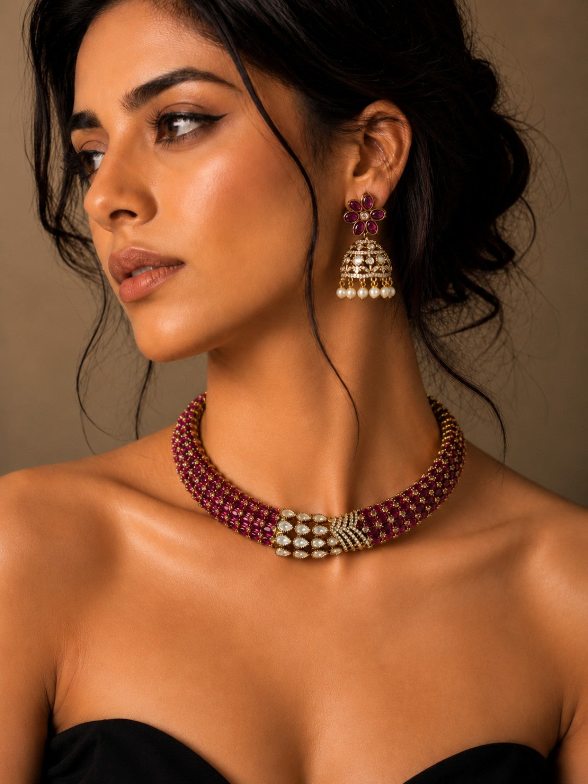 Model wearing ruby pink Moissanite Polki Kundan statement necklace set with matching jhumka