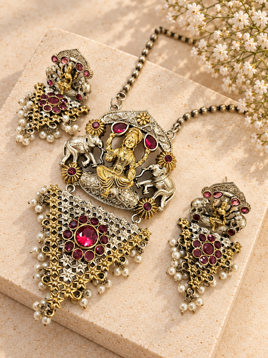 Silver Replica Dual Tone Monalisa Stone Lakshmi Pendant Set, Red colour, on beige square stone with small white flowers.