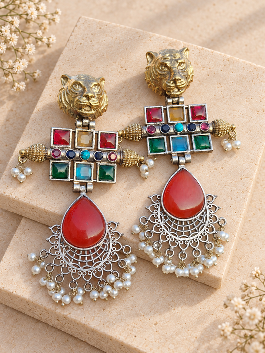 Dual-Tone Tiger Head Monalisa Stone Earrings, Ruby Red colour, on beige square stone with small white flowers.