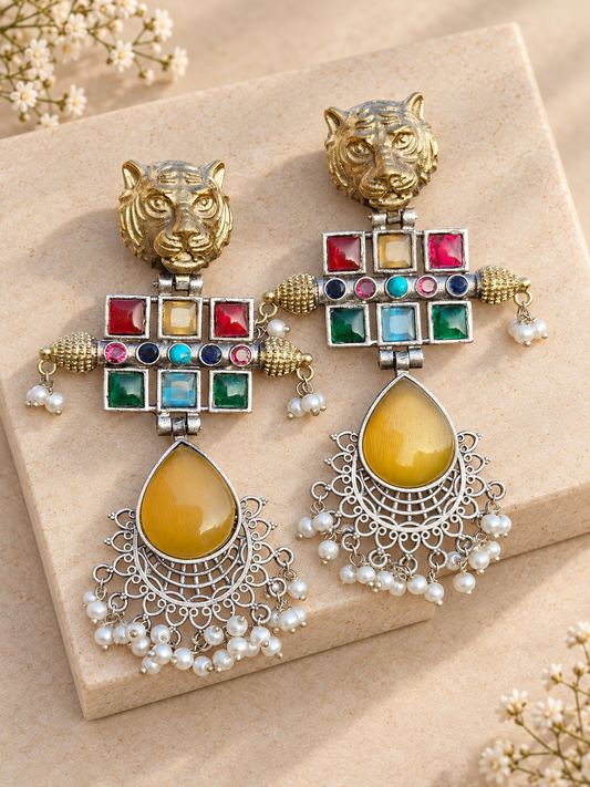 Dual-Tone Tiger Head Monalisa Stone Earrings, Yellow colour, on beige square stone with small white flowers.