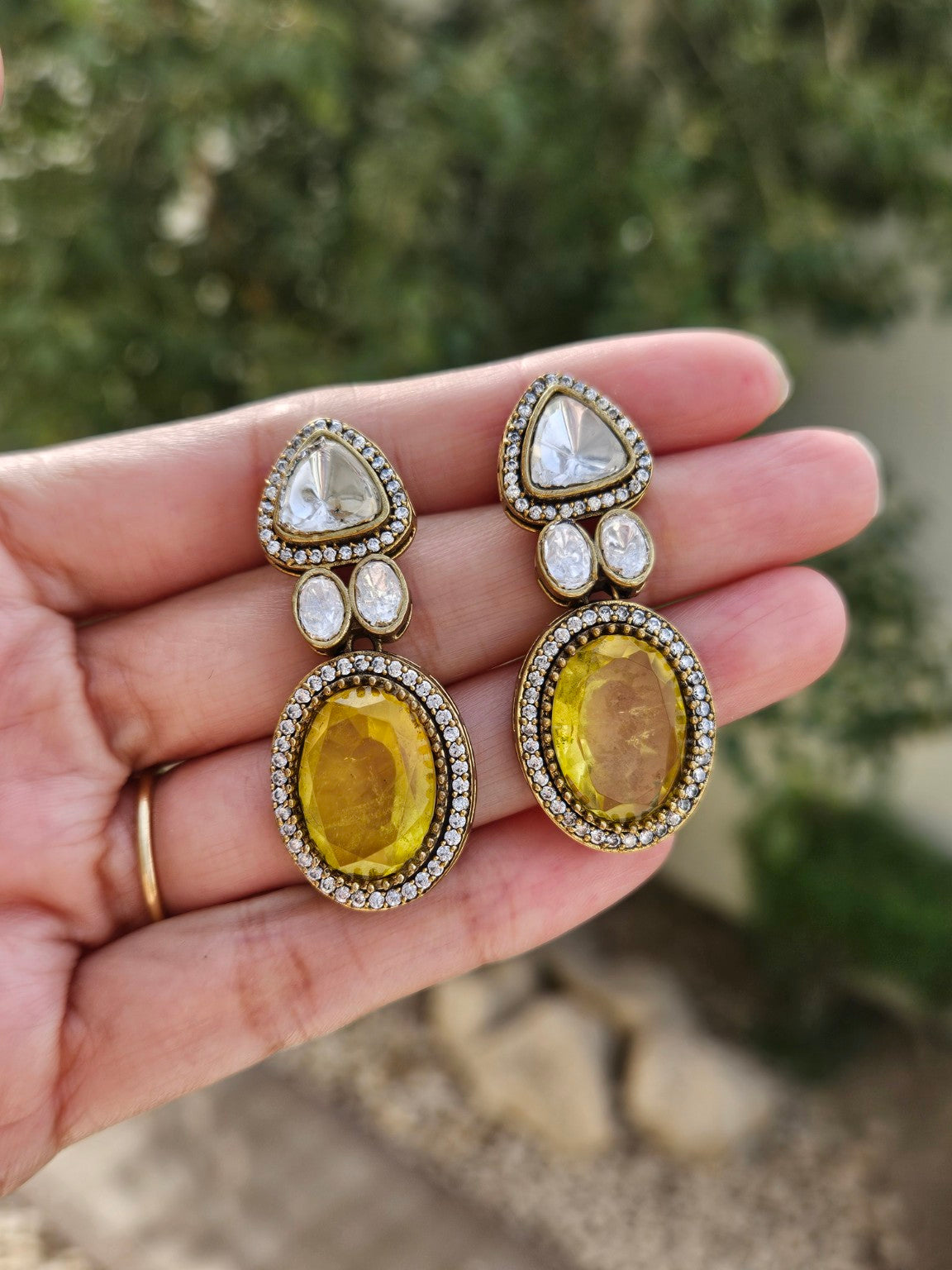 Yellow Moissanite Polki Kundan doublet stone earrings photographed in natural daylight