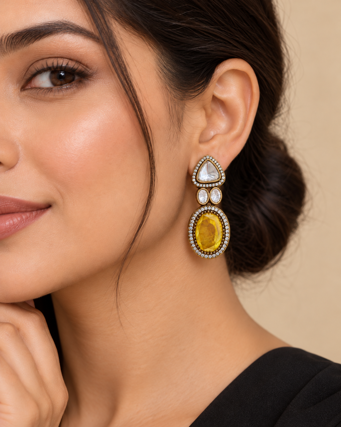 Model wearing yellow Moissanite Polki Kundan doublet stone earrings with antique gold finish