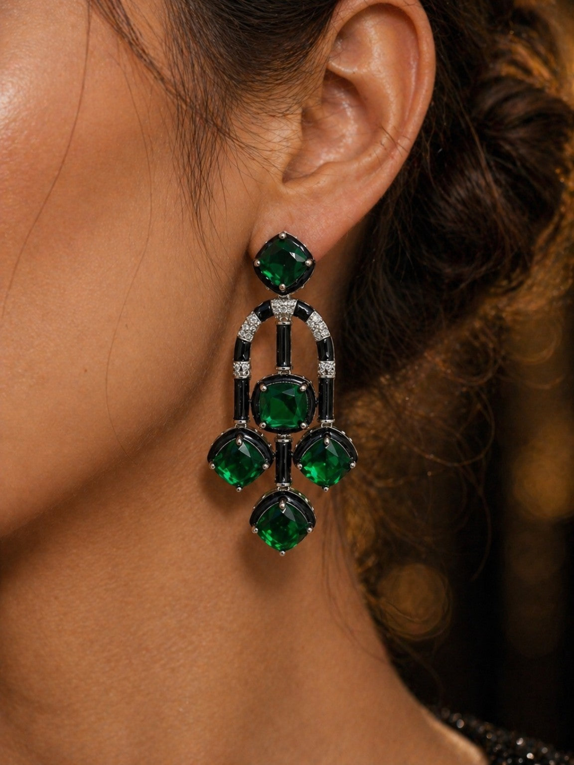 Model wearing green premium cut stone enamel statement earrings