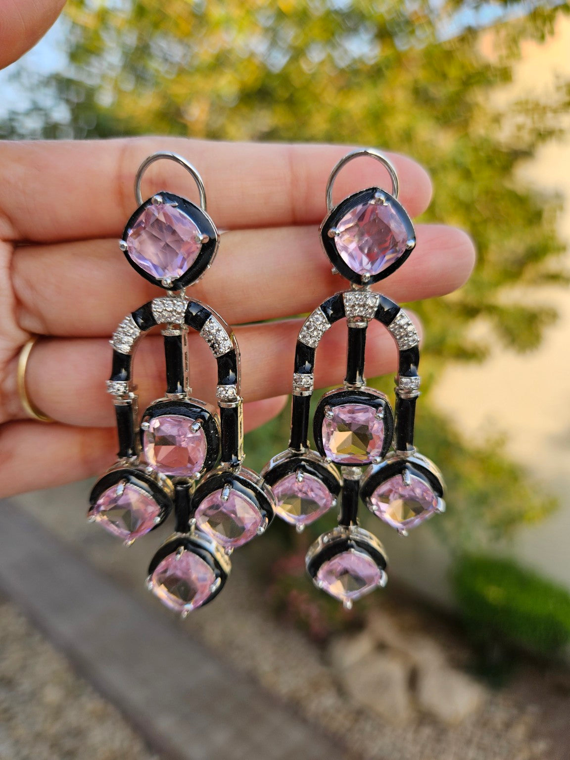 Pink premium cut stone enamel earrings photographed in natural daylight